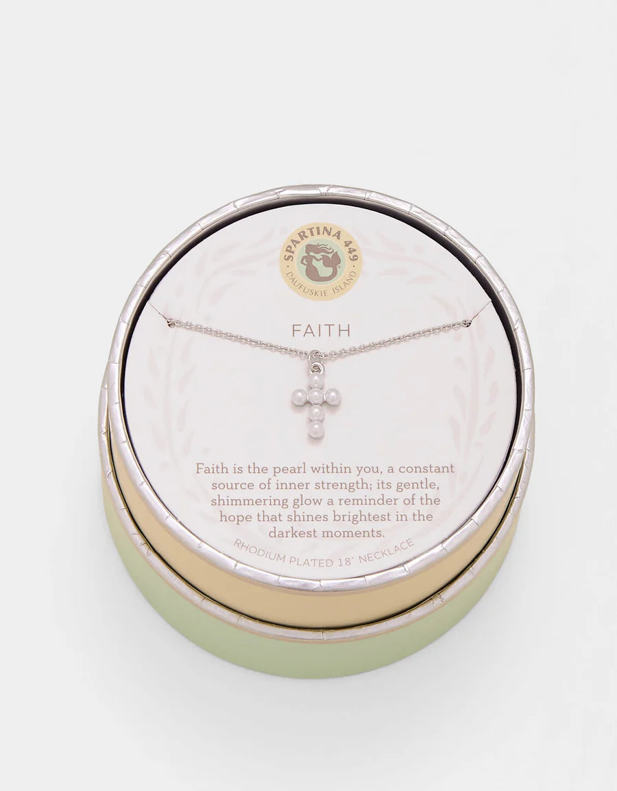 Necklace with cross pendant in a 'Faith' themed jewelry box on a white background