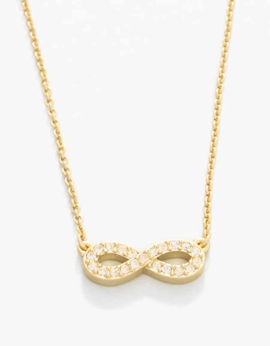 Gold infinity necklace on a white background