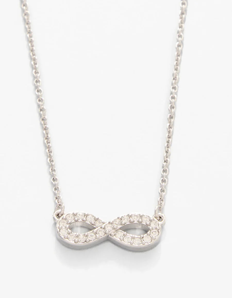 Silver infinity necklace with clear stones on a white background