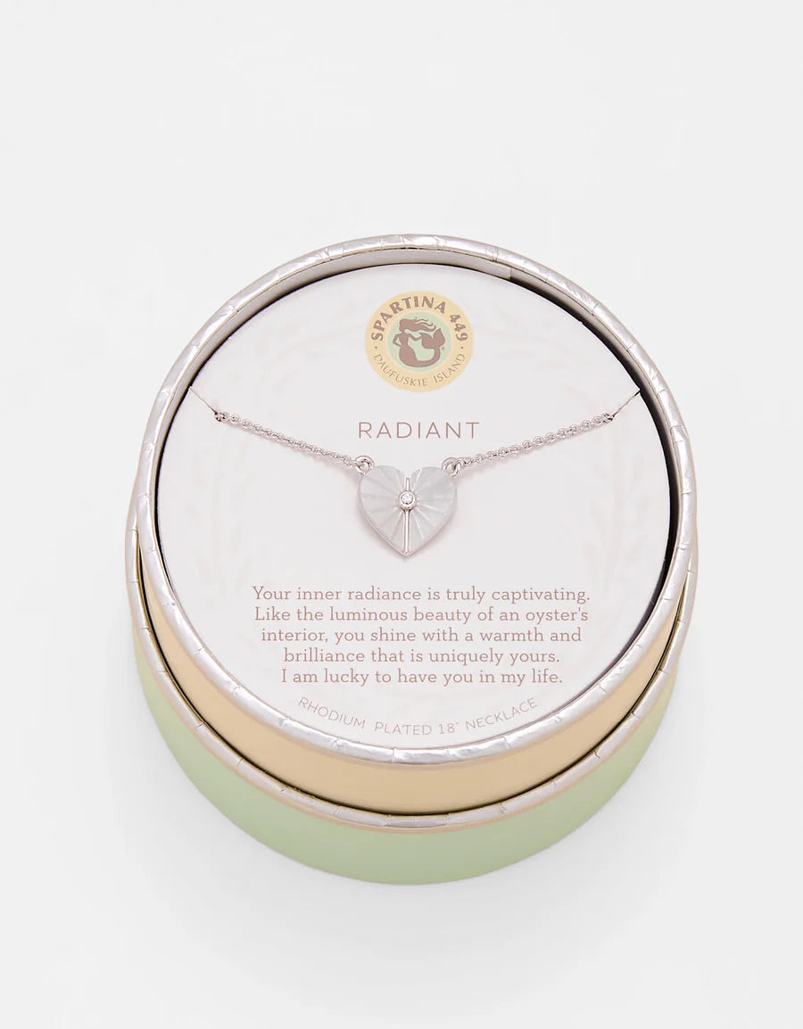 Heart-shaped necklace in a branded jewelry box on a white background