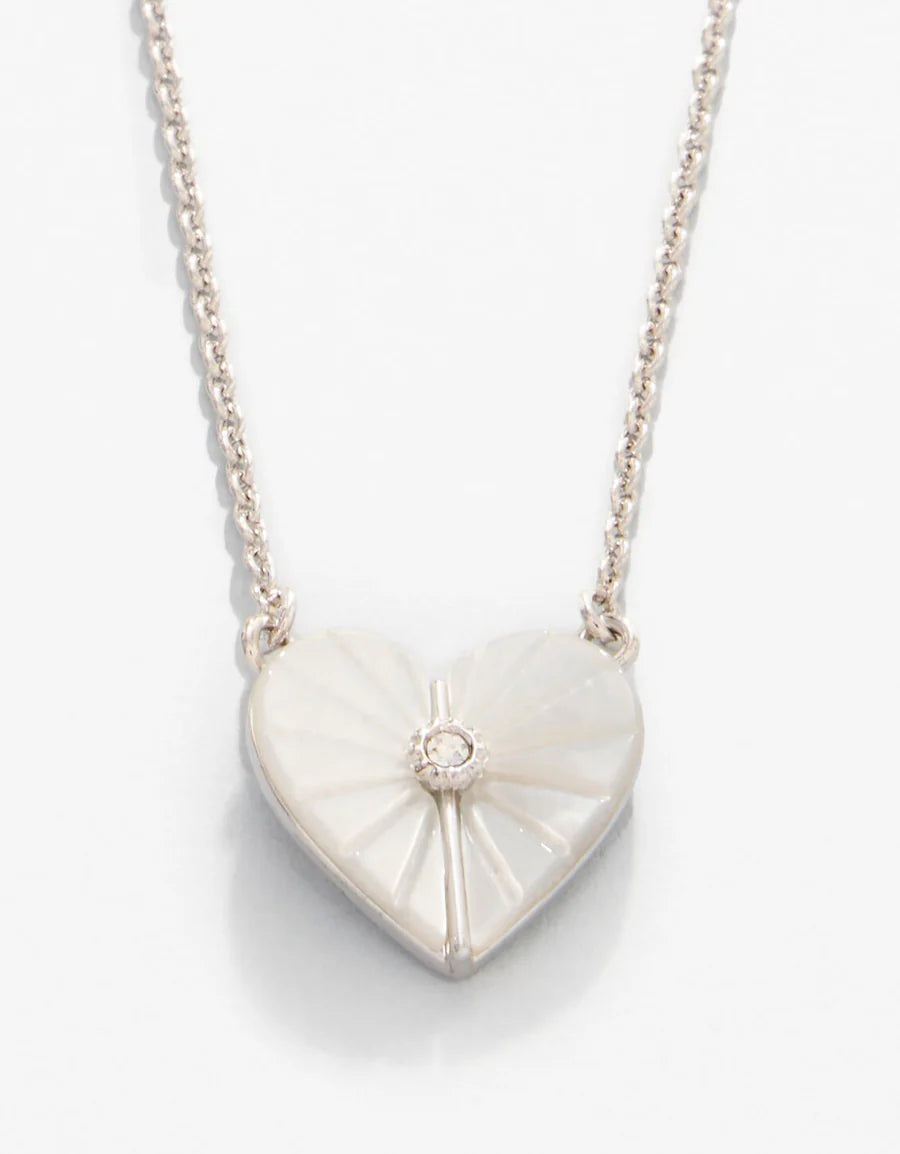 Heart-shaped pendant necklace with a diamond on a white background