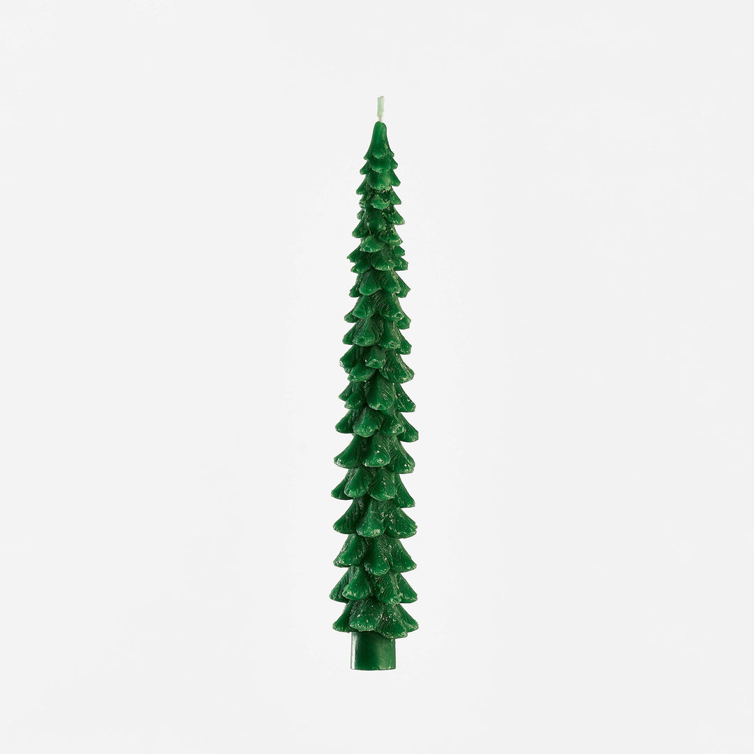 large wax green tree candle on white background