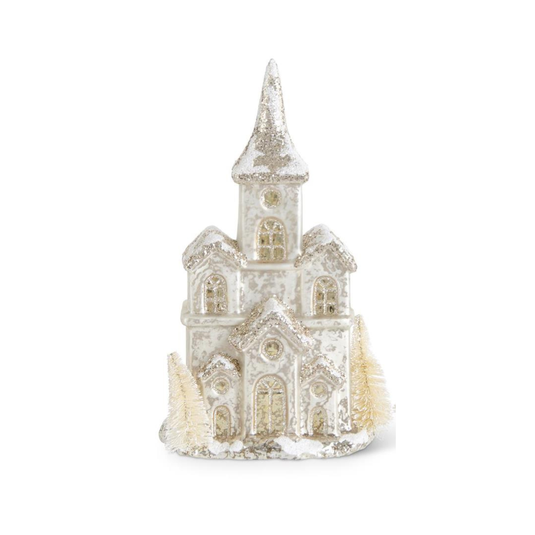 Decorative model of a castle with a steeple on a white background