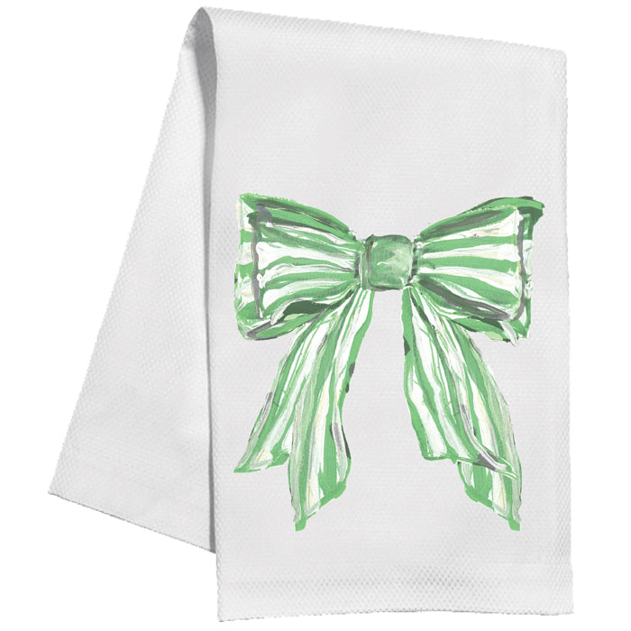 White towel with a green bow design on a white background