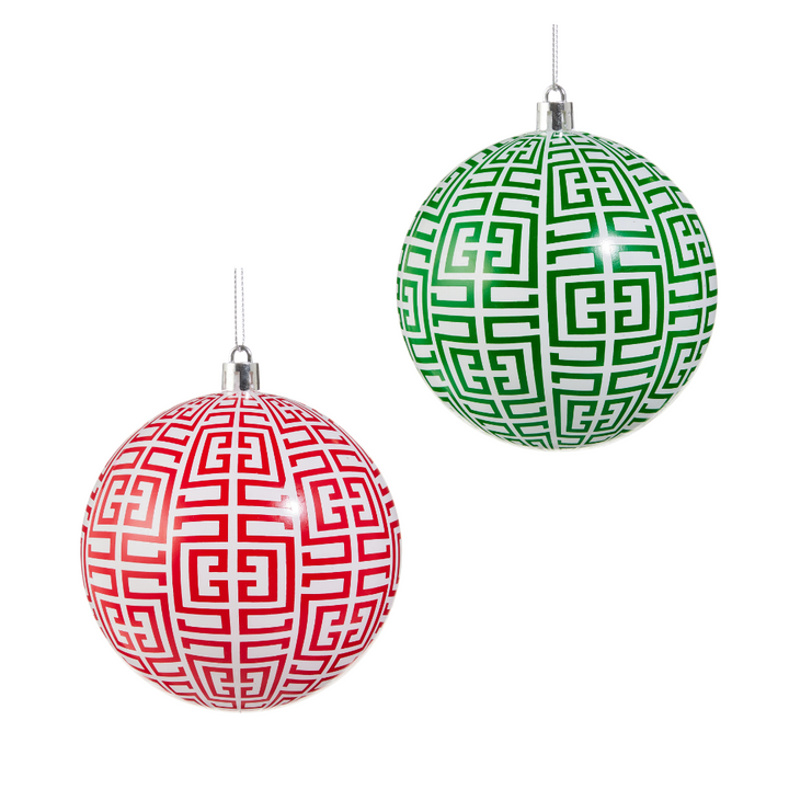 Two Christmas balls, one red and one green, with geometric patterns on a white background.