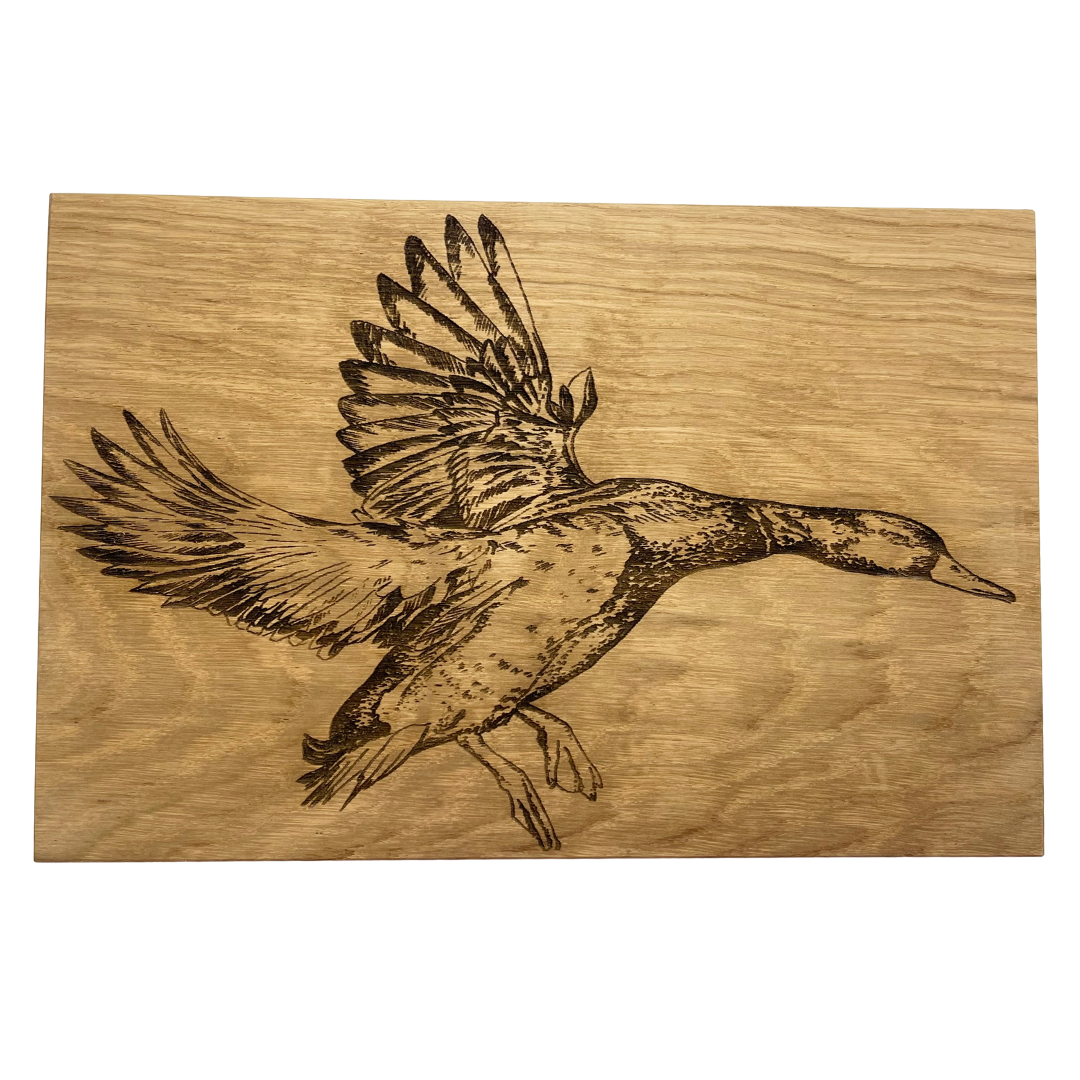 Wooden cutting board with a engraved image of a duck