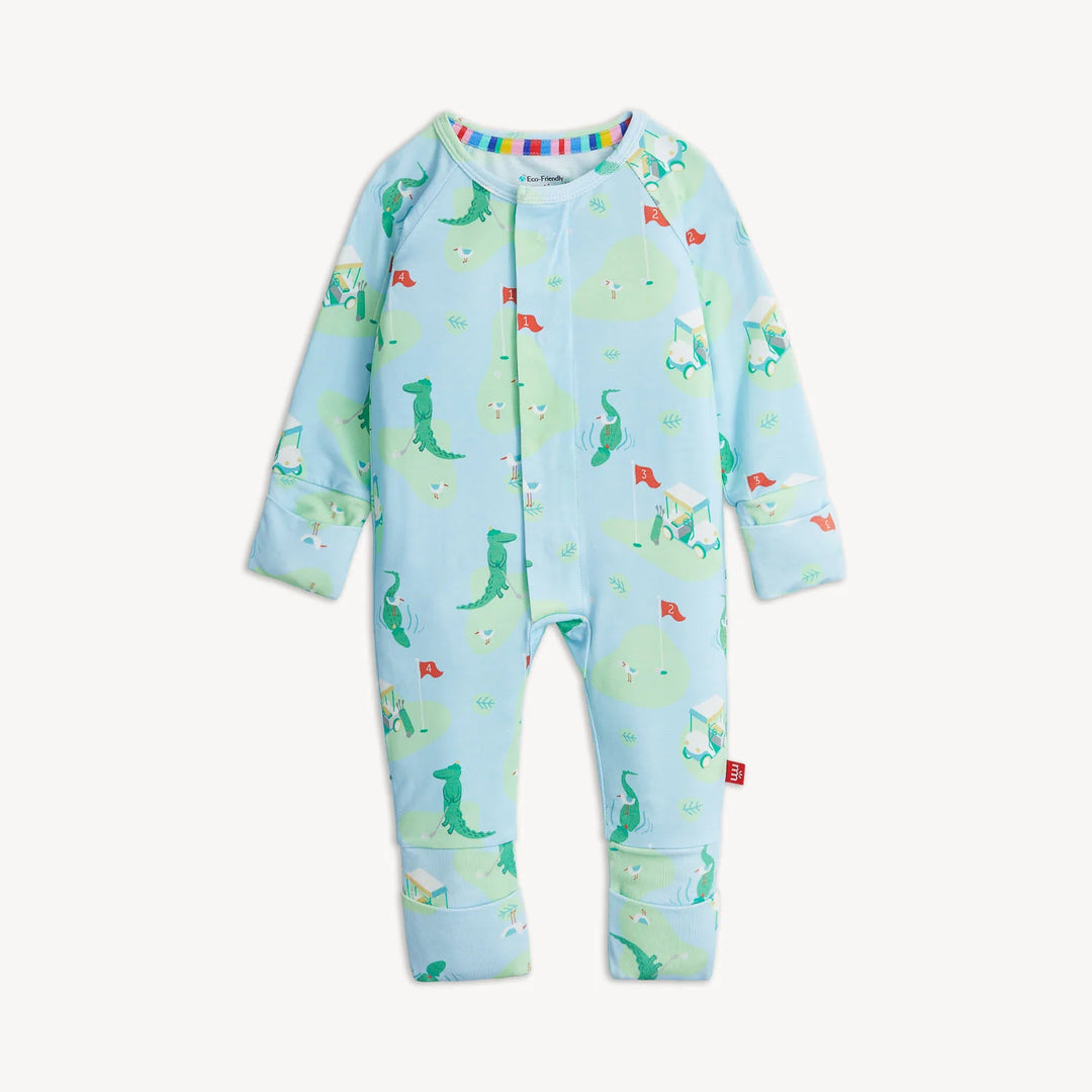 A baby long-sleeve footless one-piece jumpsuit in light blue, featuring a playful print of green alligators on the golf course shown against a plain off-white background.