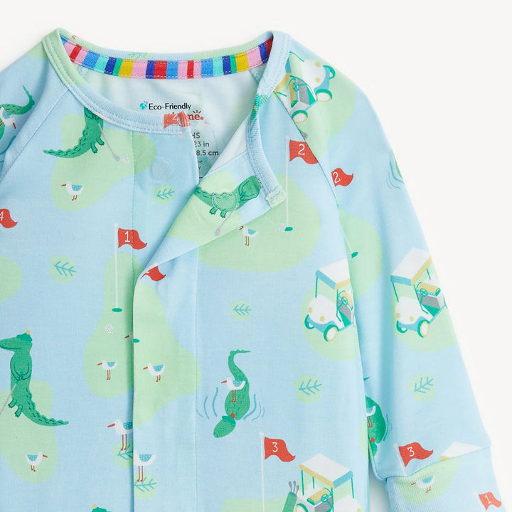 Children's jacket with alligator pattern on a light blue background