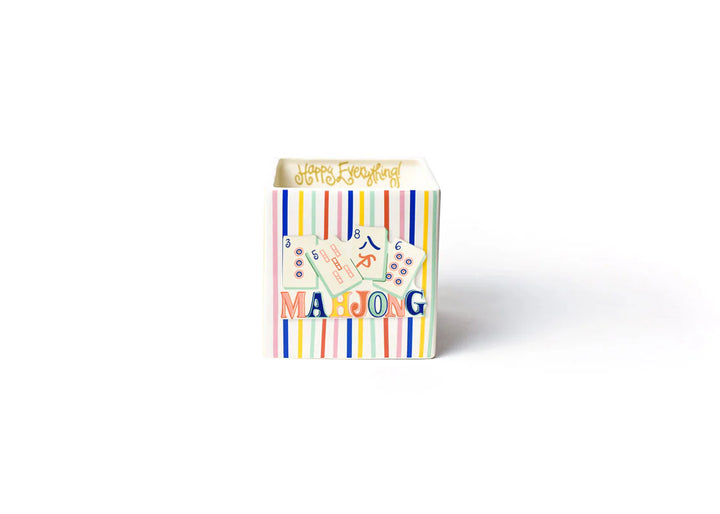 Colorful box of Mahjong game pieces on a white background