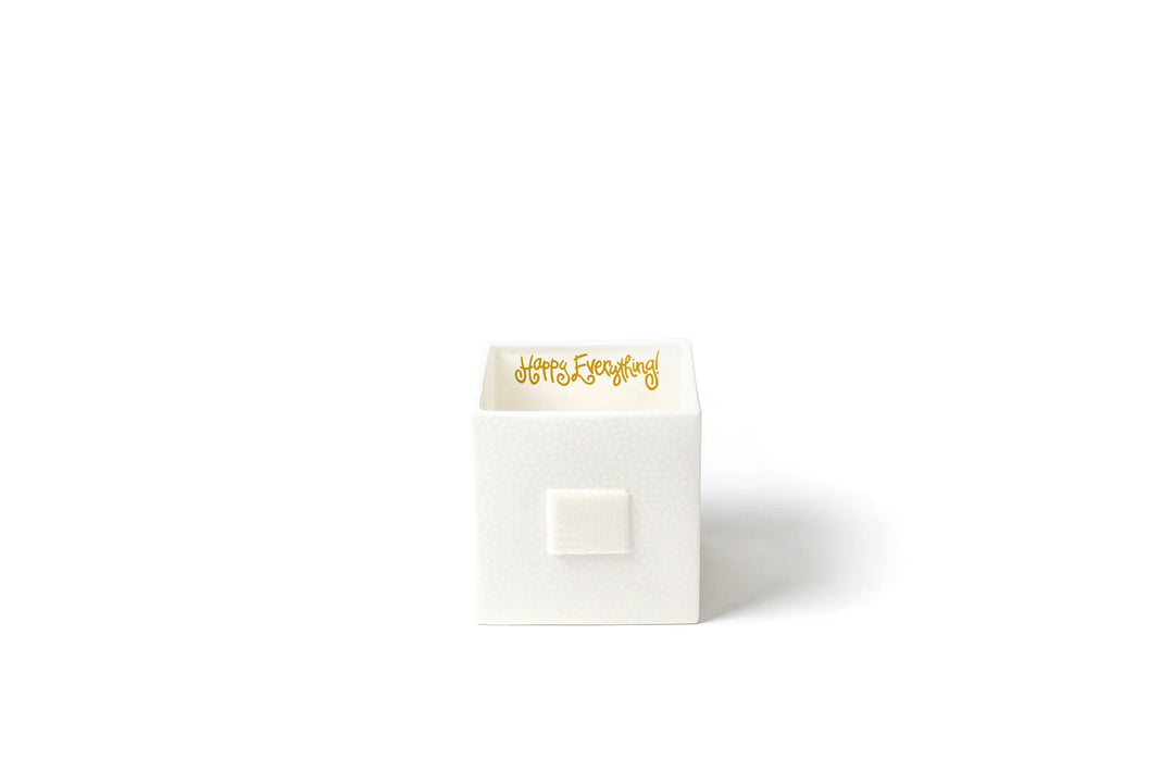 White gift box with gold text on a white background