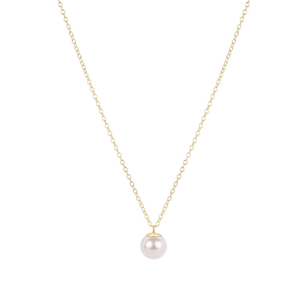 Gold necklace with a single pearl pendant on a white background