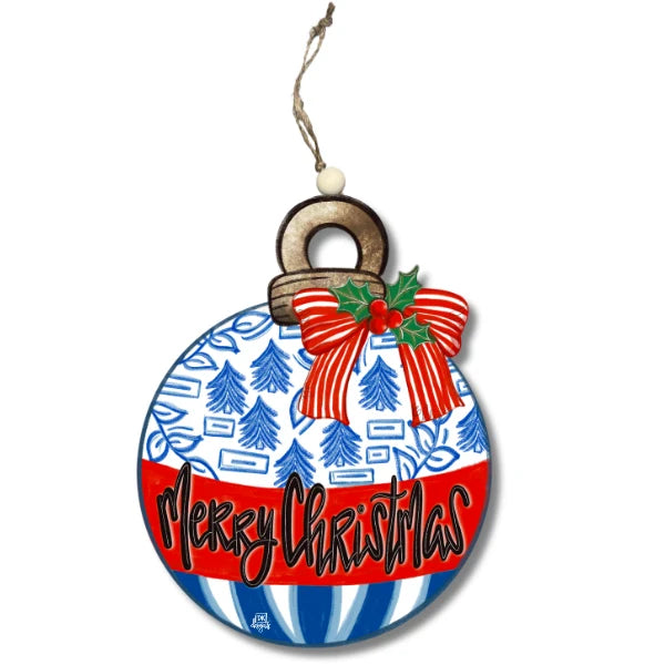 A round Christmas ornament with a hanging loop, featuring a blue and white patterned top half, a red and white striped bottom half with 'Merry Christmas' in black script, a red bow with green holly leaves, and a small tree motif.