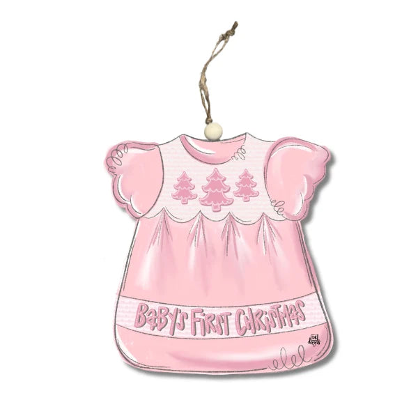 Pink baby dress ornament with 'Baby's First Christmas' text on a white background