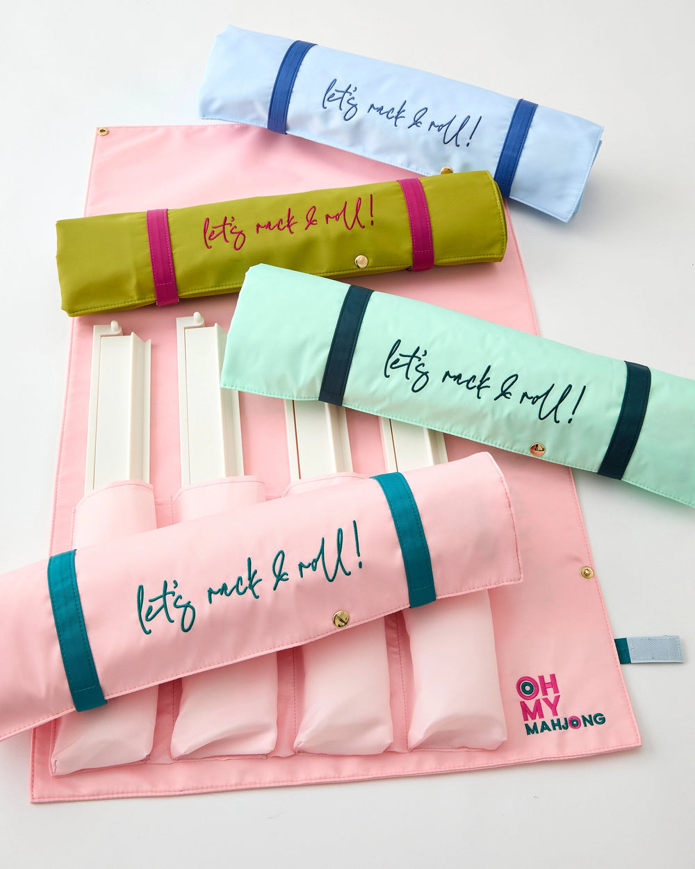 Set of colorful rolling storage bags with "let's rack and roll" on a light background