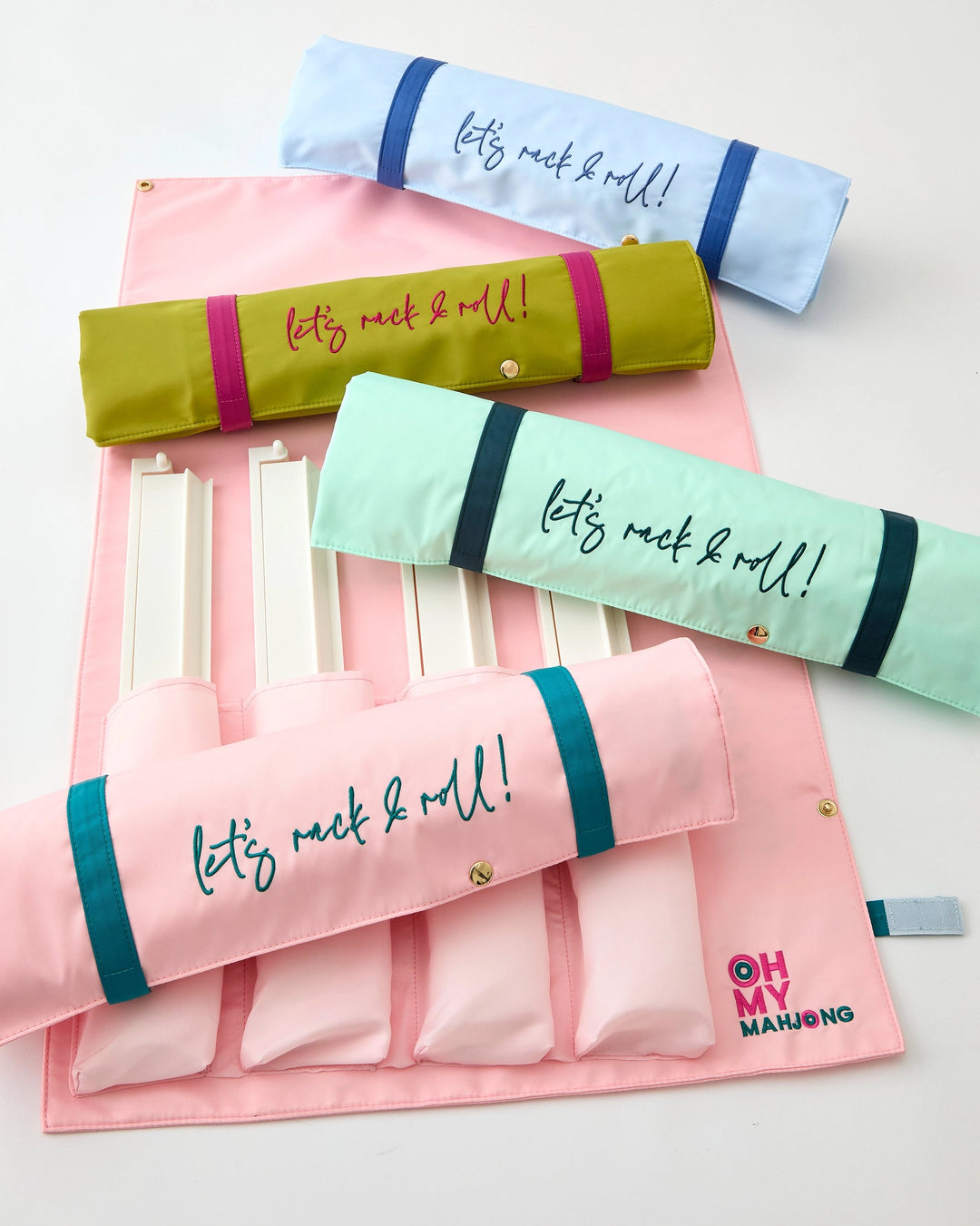 Set of colorful rolling storage bags with "let's rack and roll" on a light background