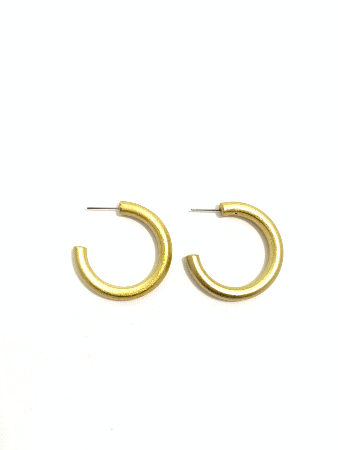 A pair of small gold-toned metal C-shaped hoop earrings with straight post backings, shown on a plain white background.