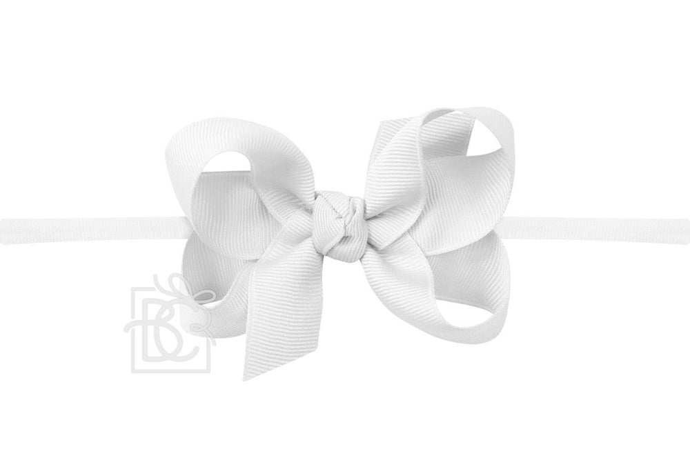 A white pantyhose headband with a bow