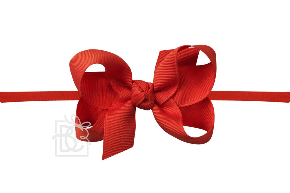 A red pantyhose headband with a large bow.