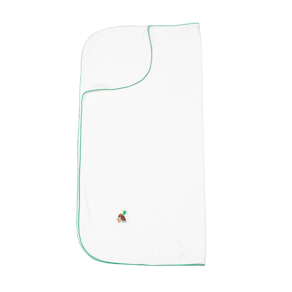 White baby blanket with green trim and embroidered mallard design on a white background