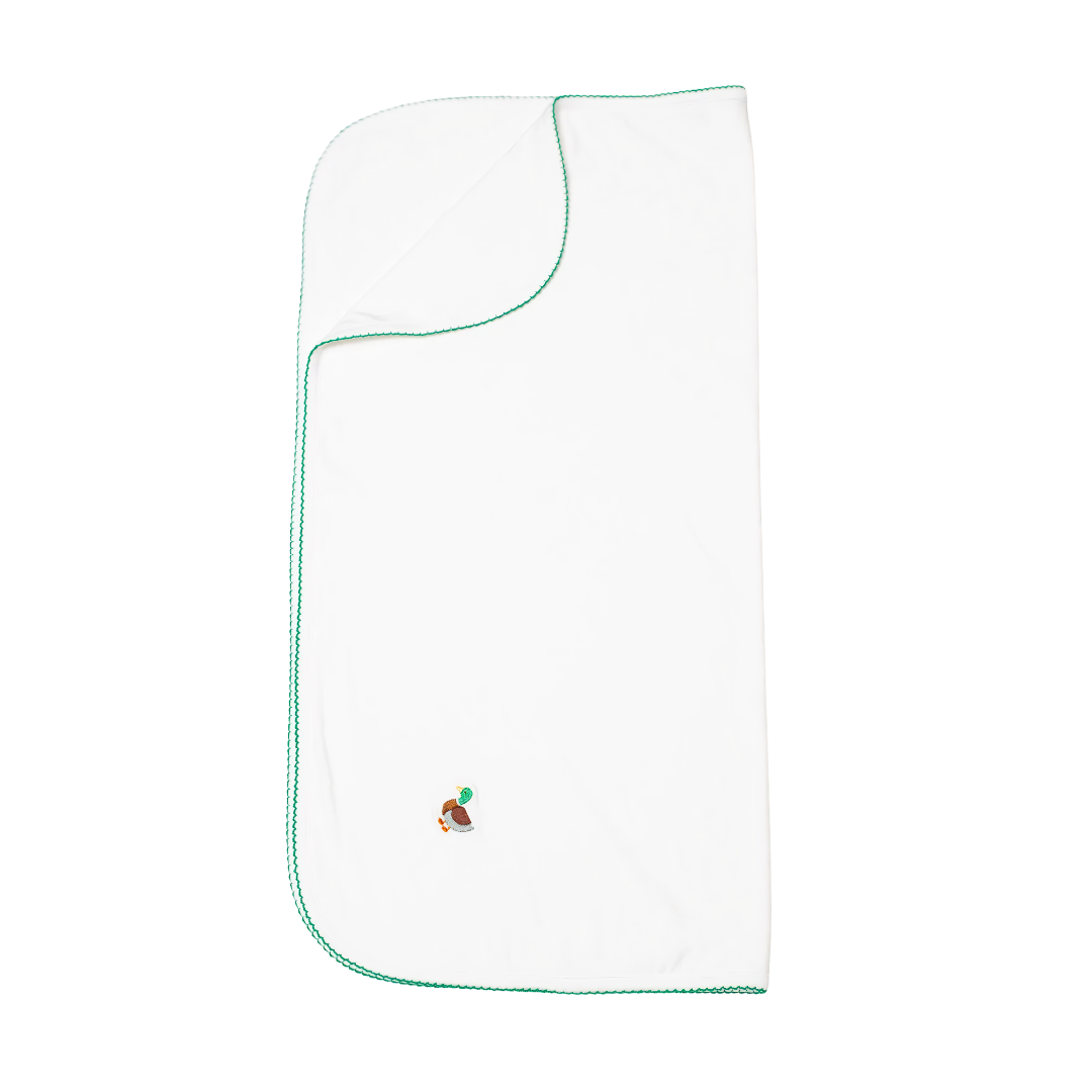 White baby blanket with green trim and embroidered mallard design on a white background