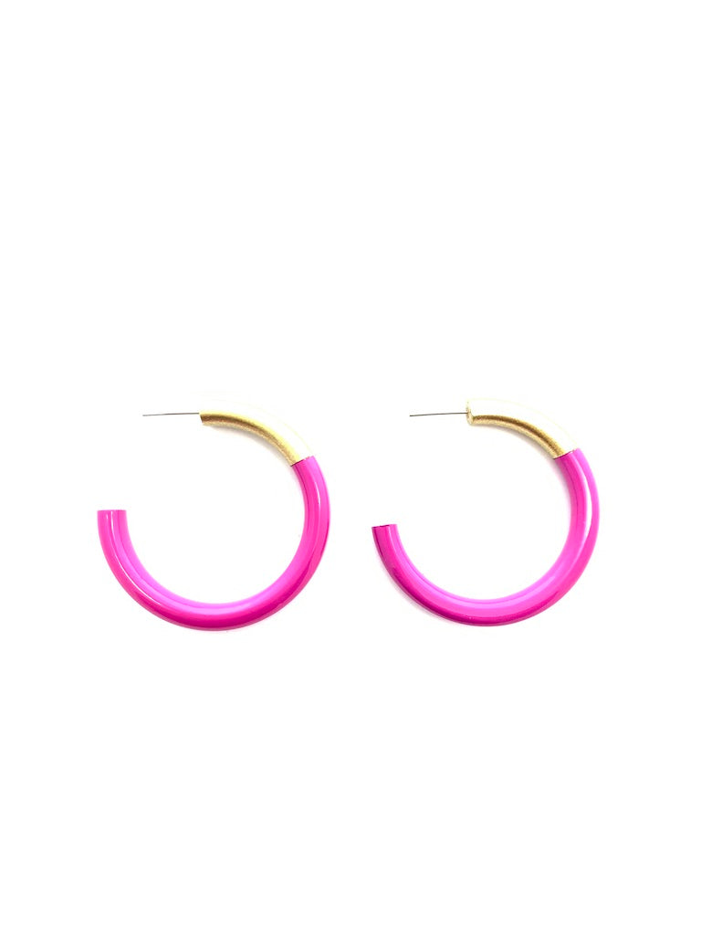 Pink hoop earrings with gold accents on a white background