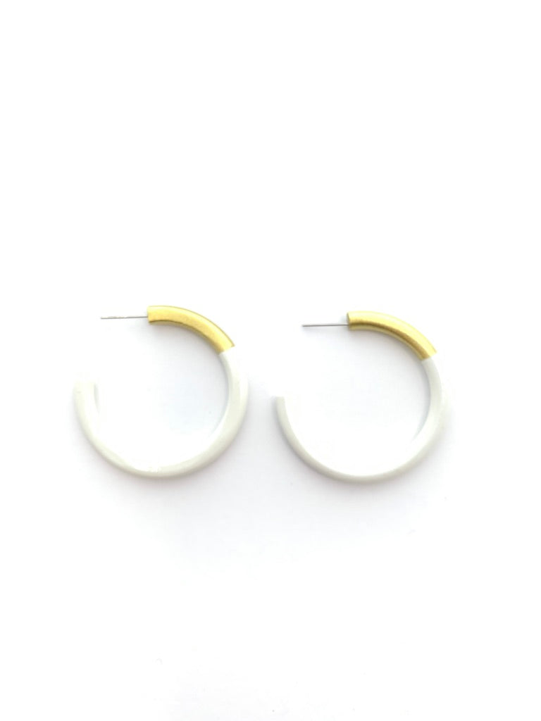 Pair of hoop earrings with gold accents on a white background