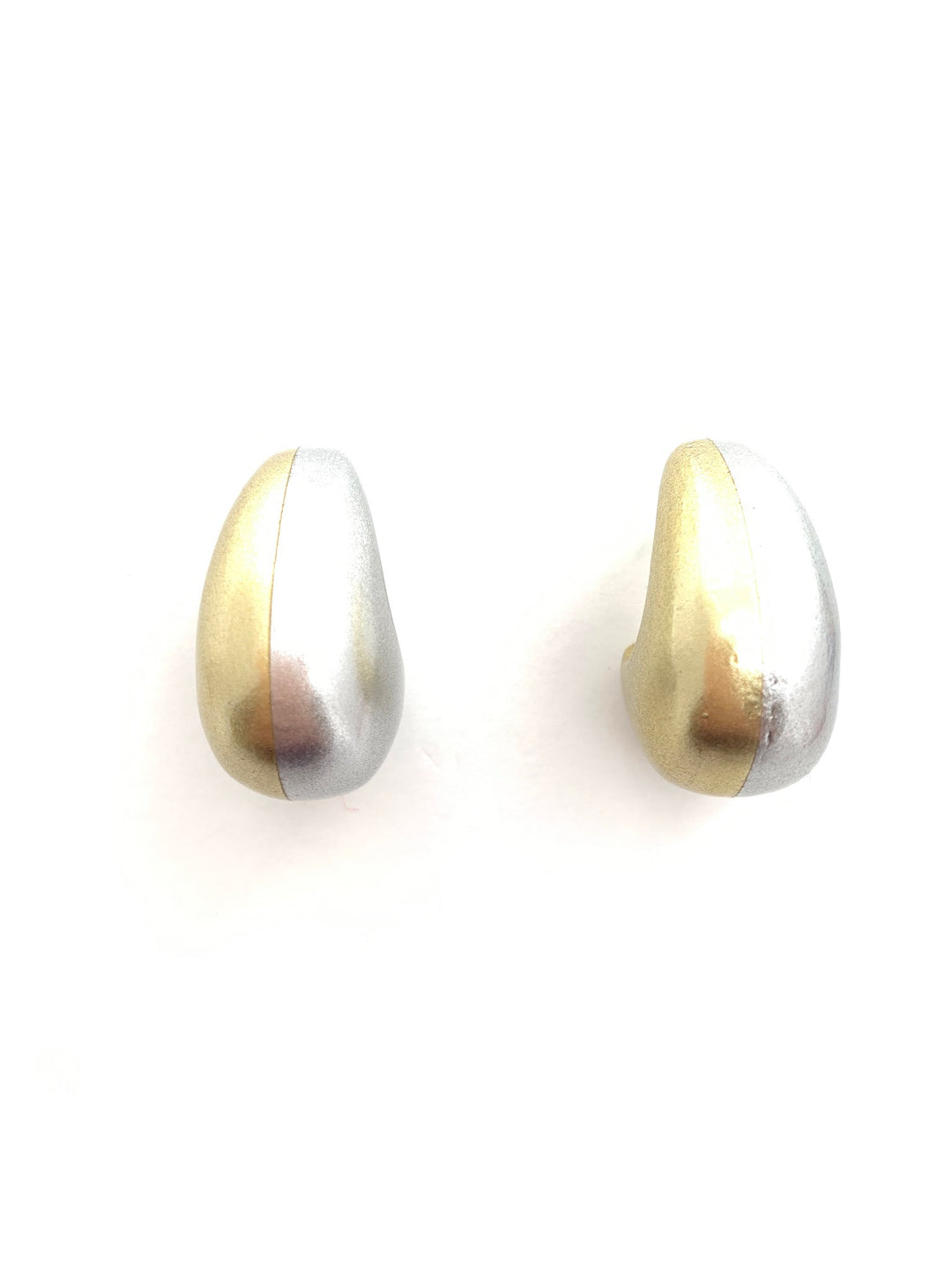 Gold and silver wall sconces on a white background