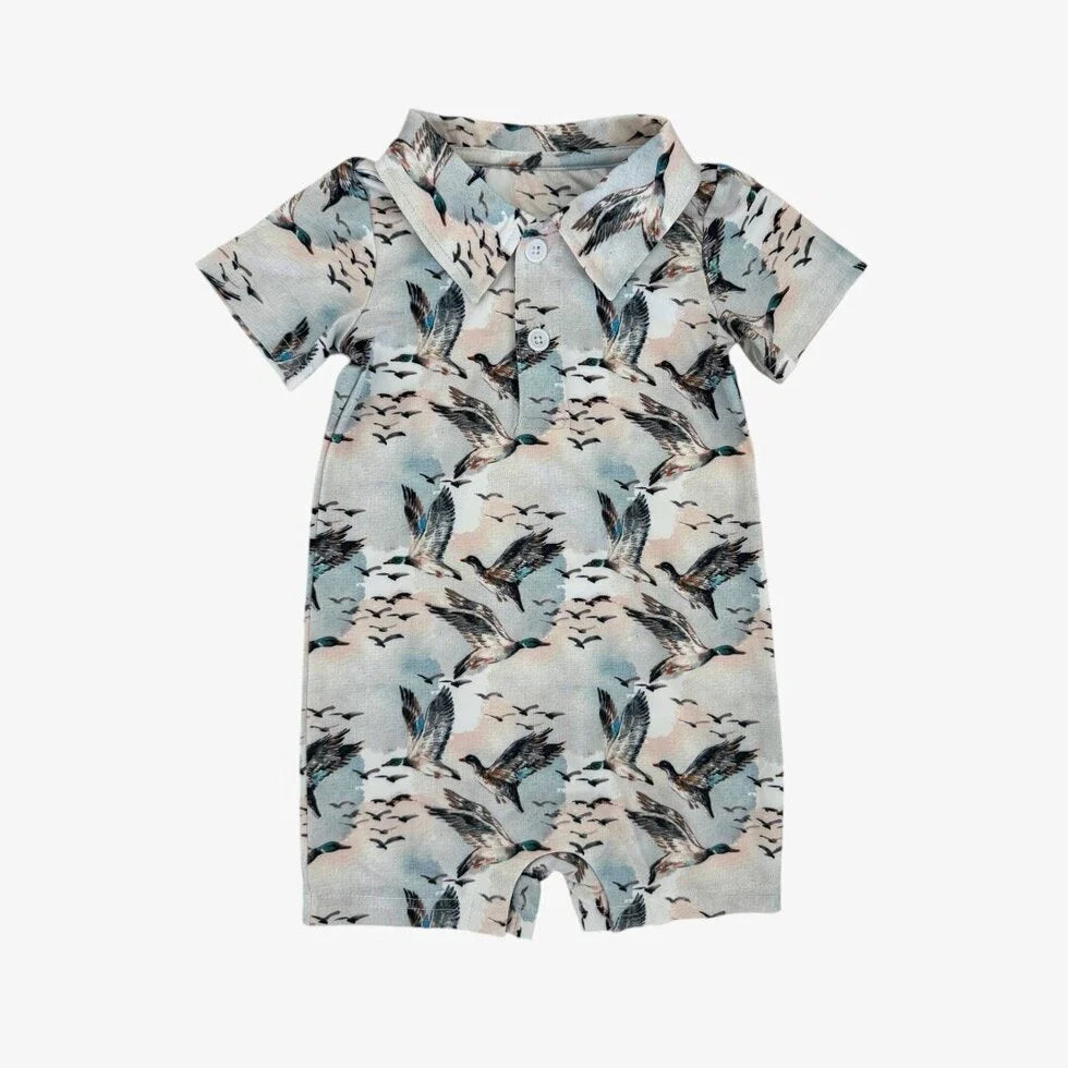 Baby romper with bird pattern on a white background