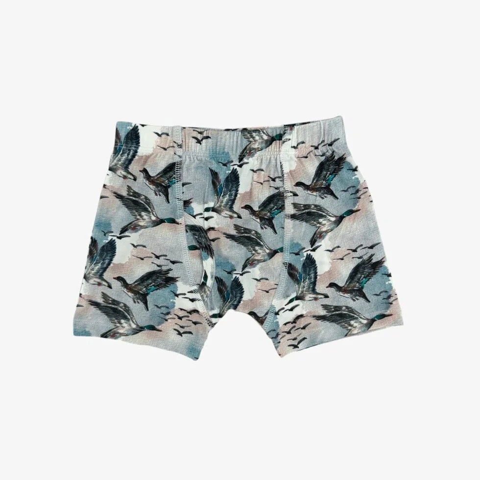 Shorts with bird pattern on a white background