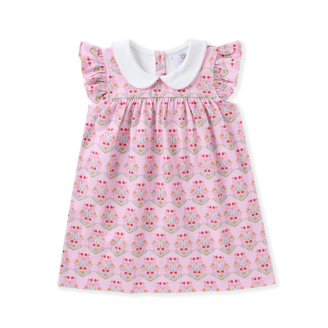 Pink dress with floral pattern and white collar on a white background