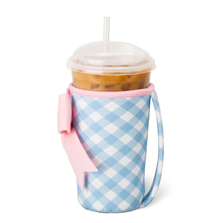 Blue gingham tumbler sleeve with pink bow and carrying handle for iced coffee cups and tumblers, reusable drink carrier accessory | Walker Boutique