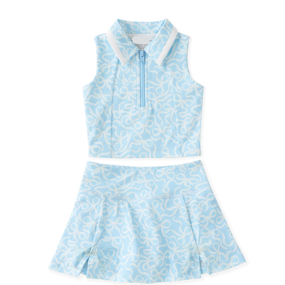 Allover sky-blue bow print with preppy appeal
Two-piece collared tank and; skort set on white background