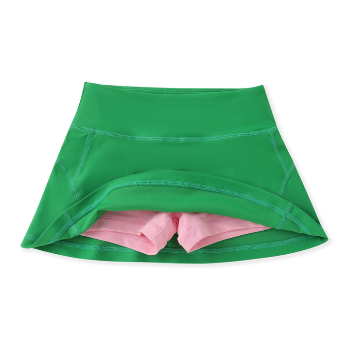 Green skirt with pink lining on a white background