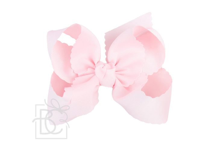 POWDER PINK SCALLOPED EDGE BOW