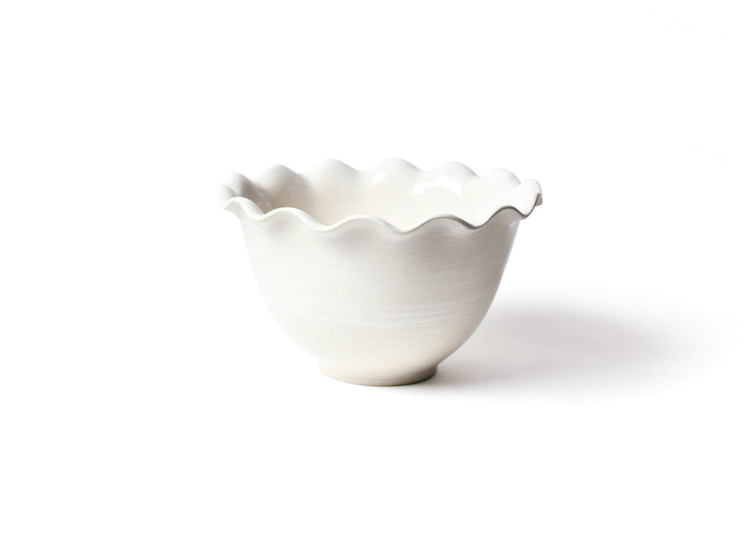 White ceramic bowl with ruffled edge on a white background