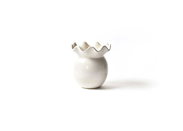 White ceramic vase with scalloped edge on a white background