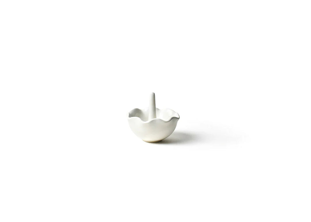White ceramic bowl with a small handle on a white background