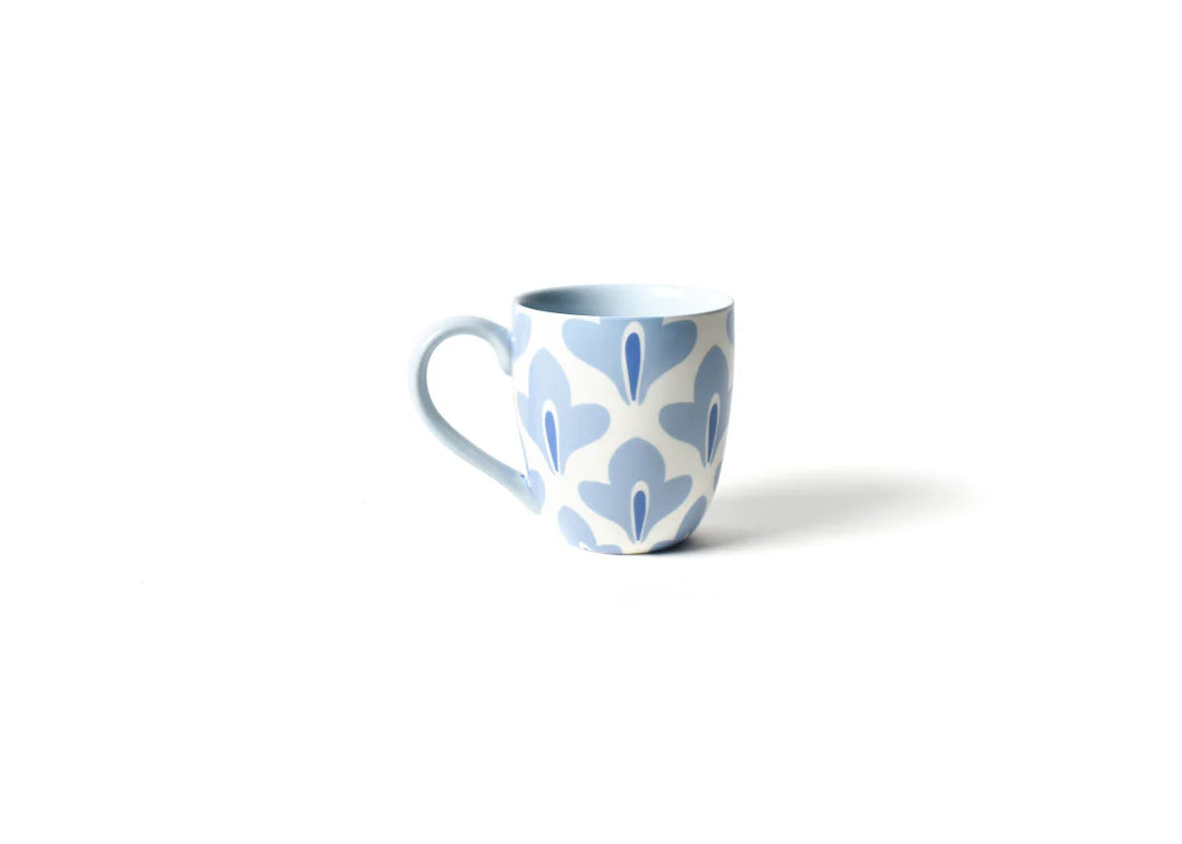 Ceramic mug with blue floral pattern on a white background