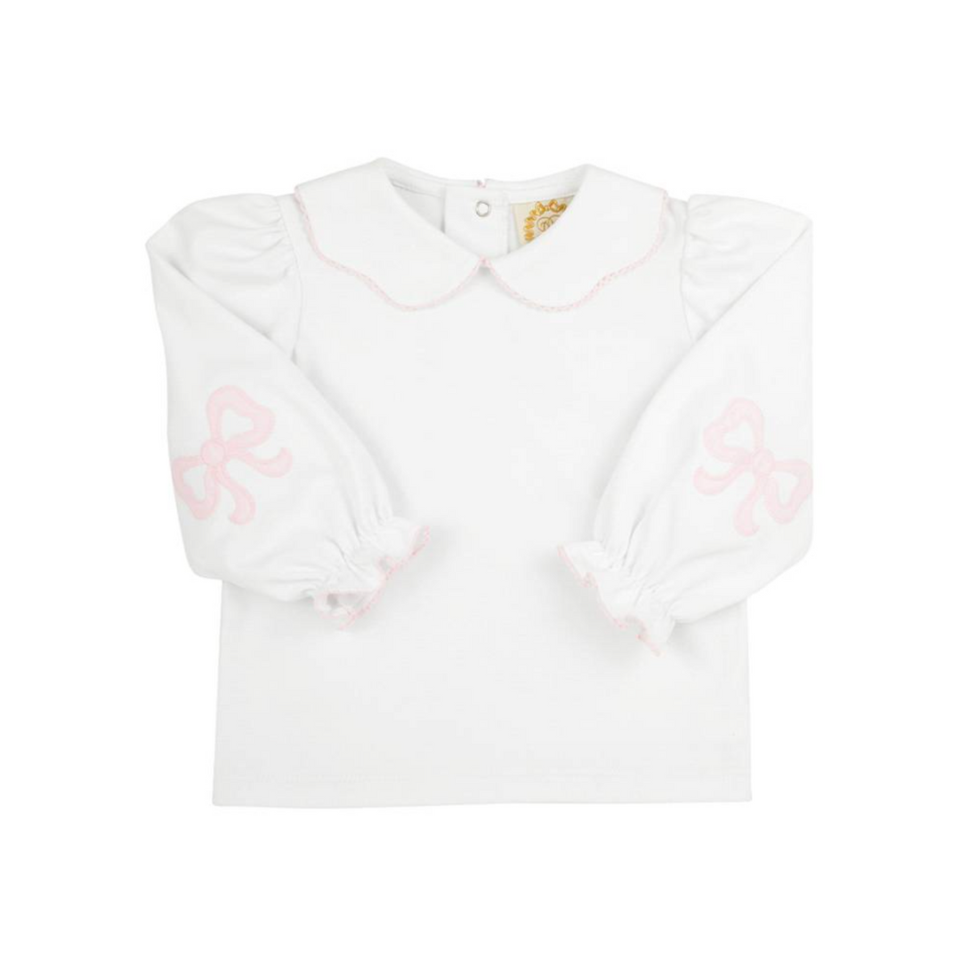 white shirt with long sleeves and collar trimmed in pink with pink applique on elbows for little girl