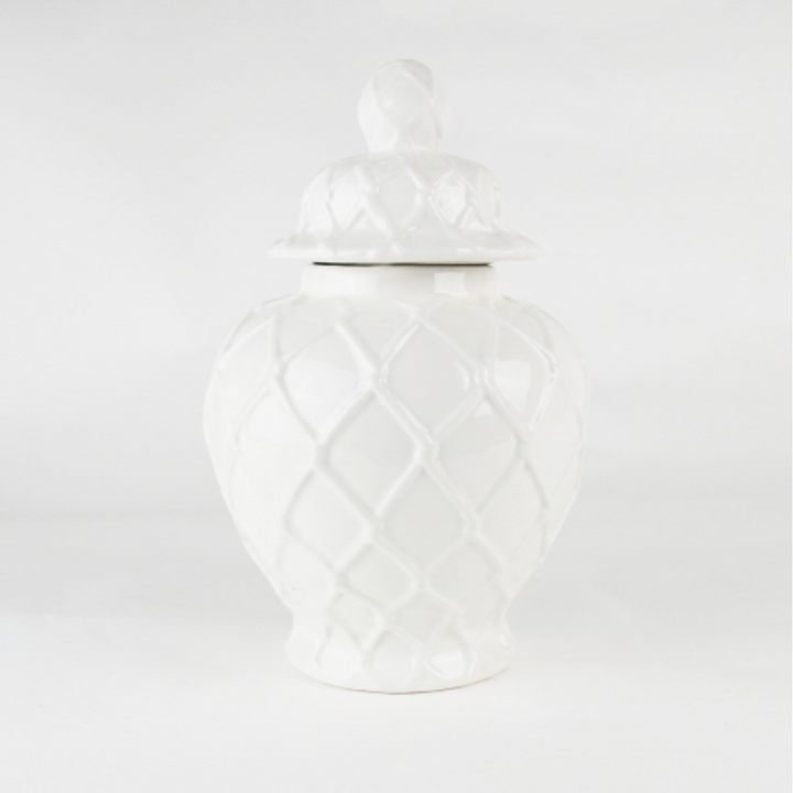 A white textured large ginger jar against a neutral background.