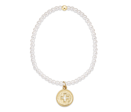 Pearl bracelet with a gold charm on a white background