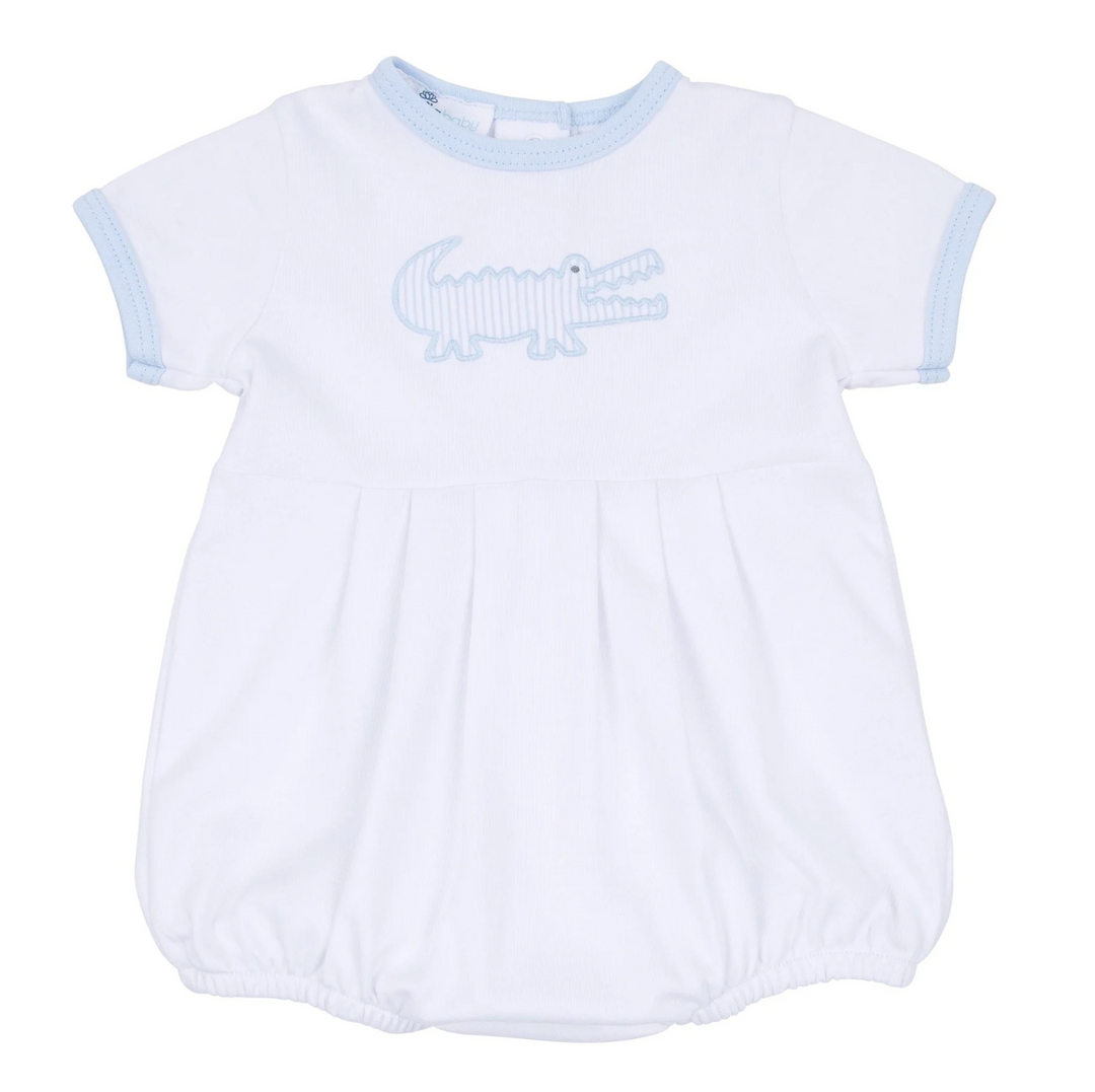 White baby romper with blue trim and alligator design on a white background