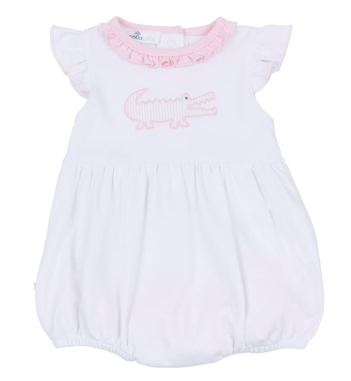 White baby romper with pink accents and a crocodile design on a white background