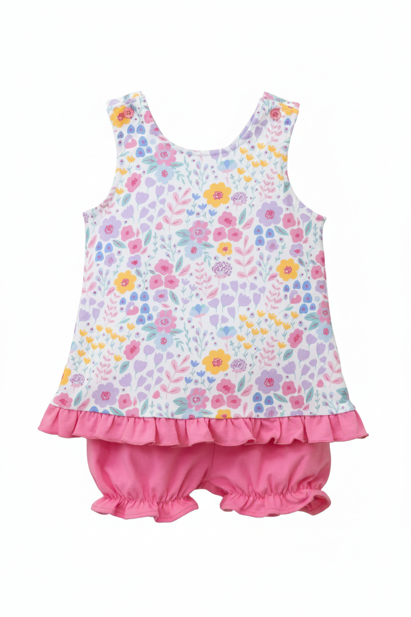 Children's floral top and pink bloomers set on a white background