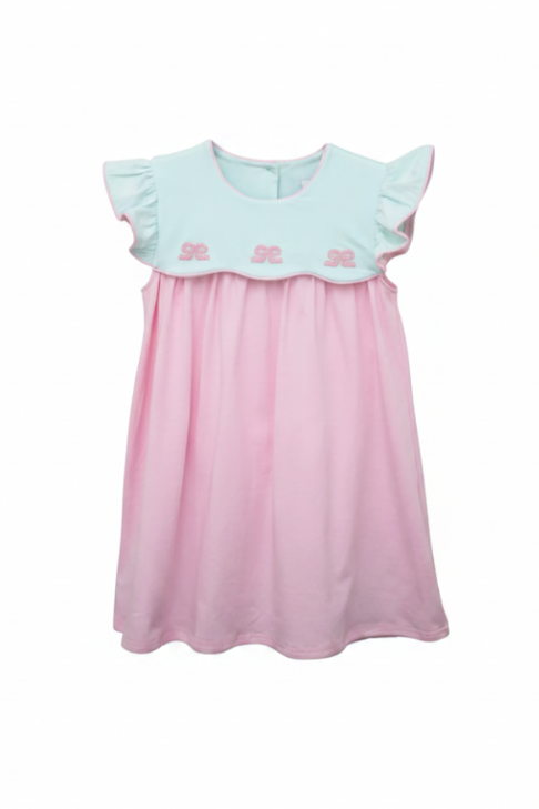 Pink dress with light mint ruffled top on a white background