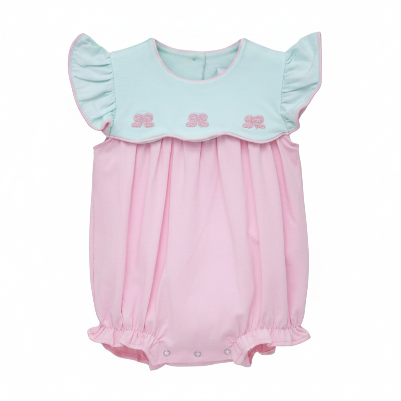 Pink baby romper with light mint top on a white background