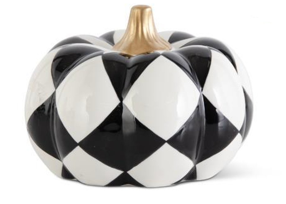 Decorative pumpkin with black and white checkered pattern on a white background