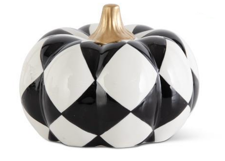 Decorative pumpkin with black and white checkered pattern on a white background