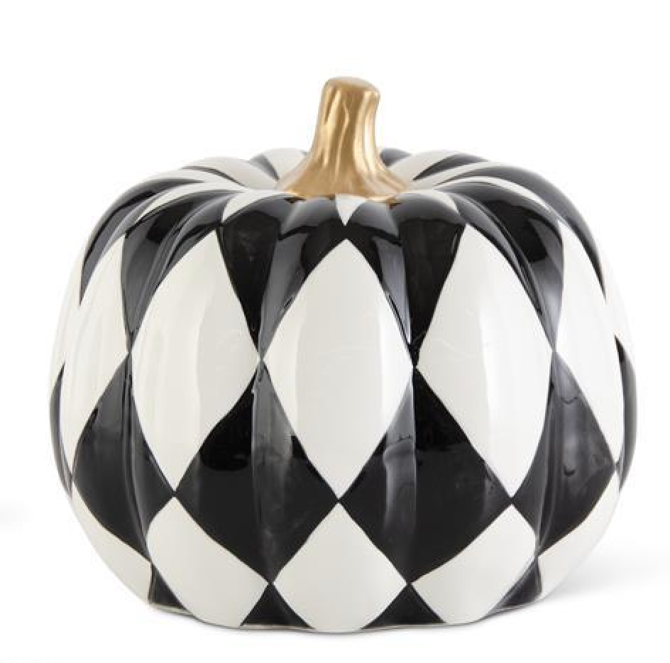 Decorative pumpkin with black and white checkered pattern on a white background