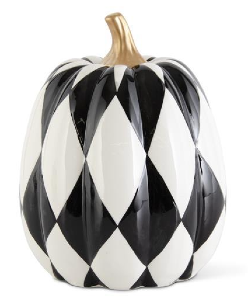 Decorative pumpkin with black and white harlequin pattern on a white background